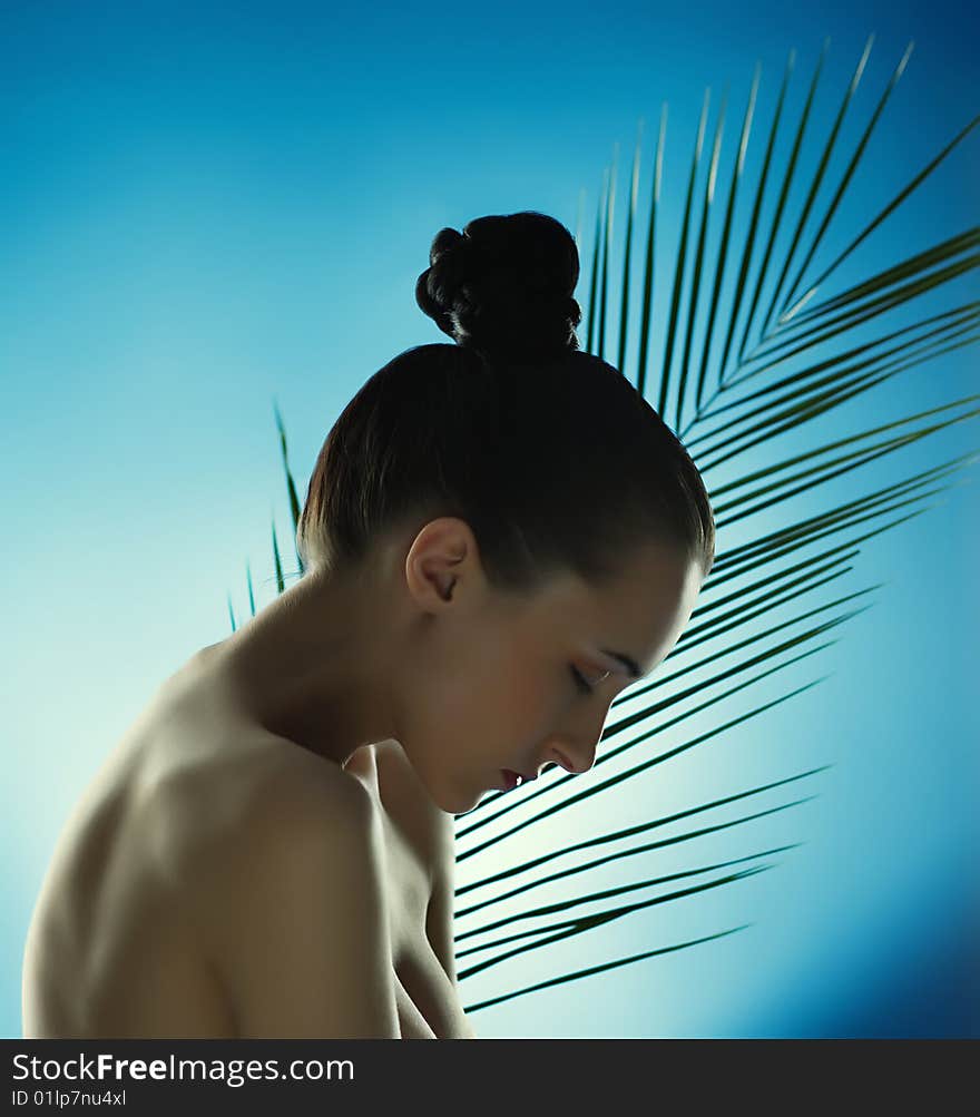 Portrait Of Beautiful Woman With The Plant.