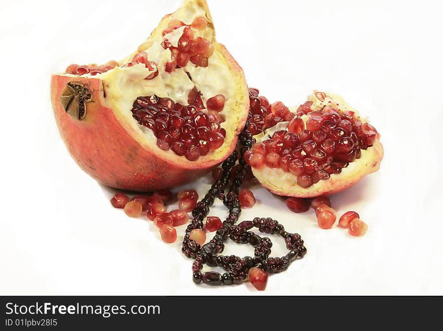 A red pomegranate with garnet on it