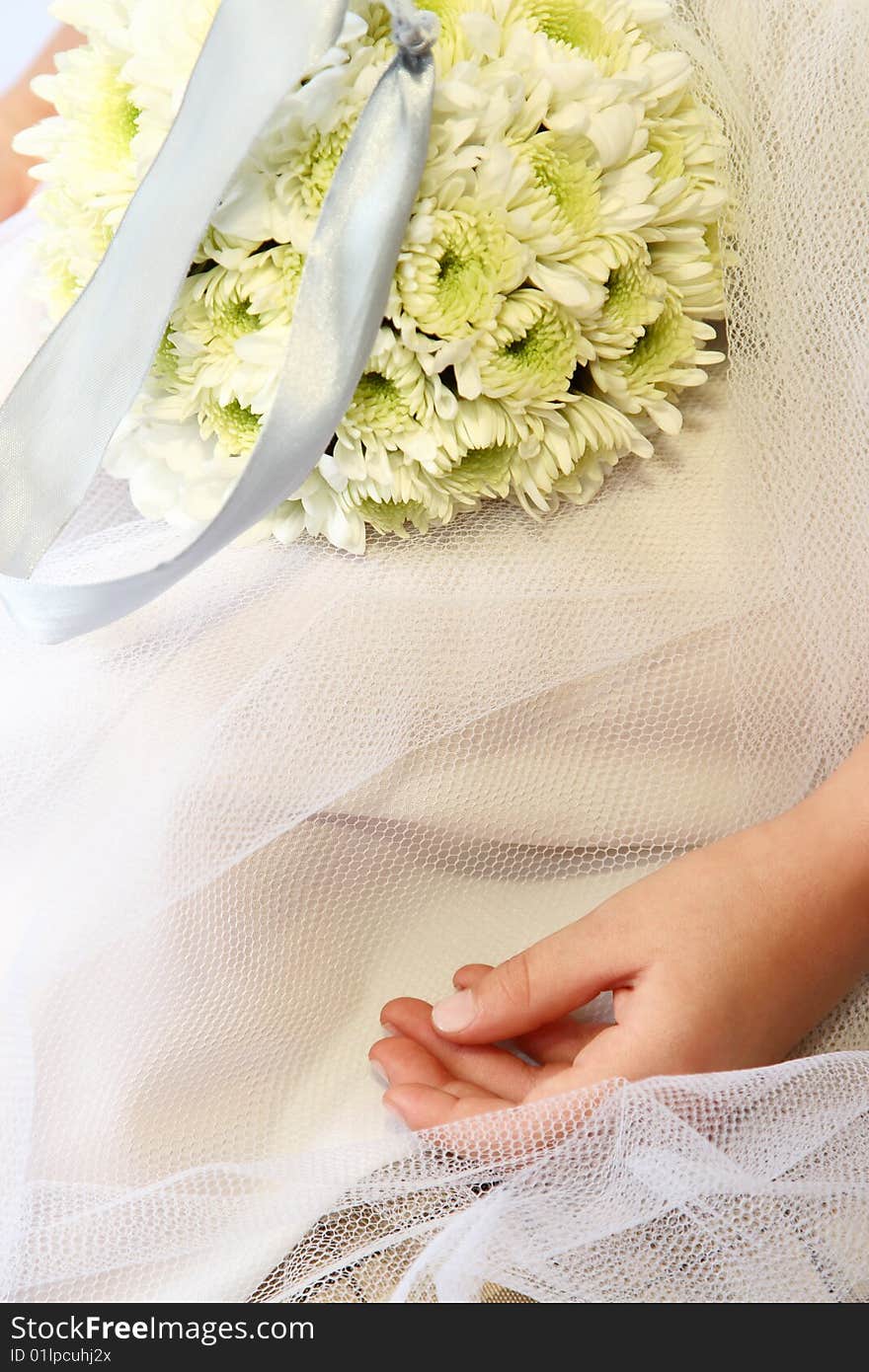 Young Bridesmaid sitting with flowers on her lap. Young Bridesmaid sitting with flowers on her lap