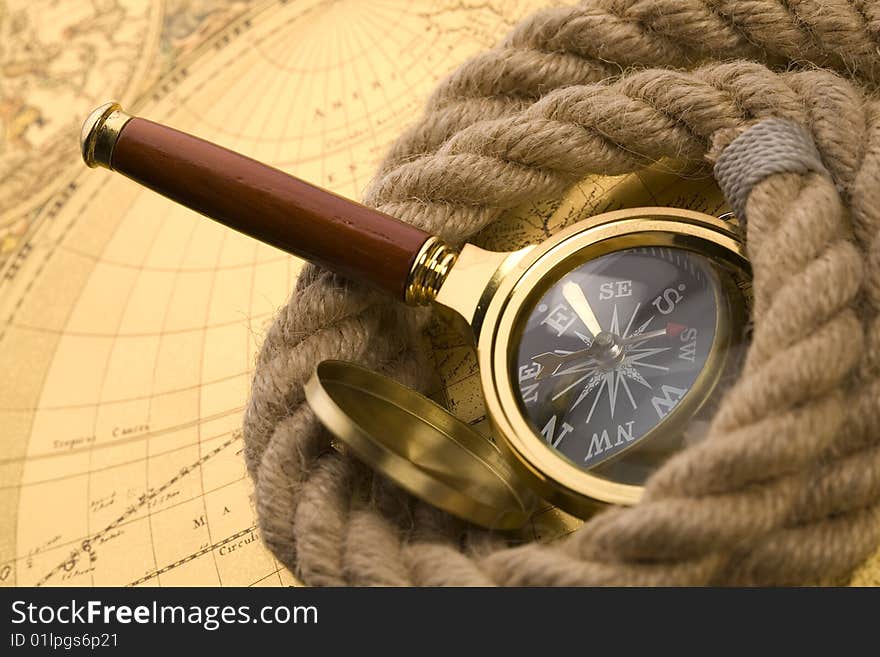 Old compass and magnifier