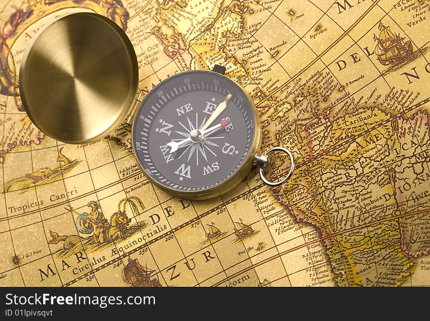 A beautiful old compass on an old map