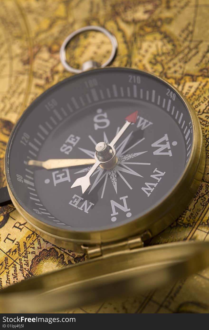 A beautiful old compass on an old map