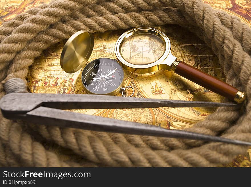 Old compass and magnifier