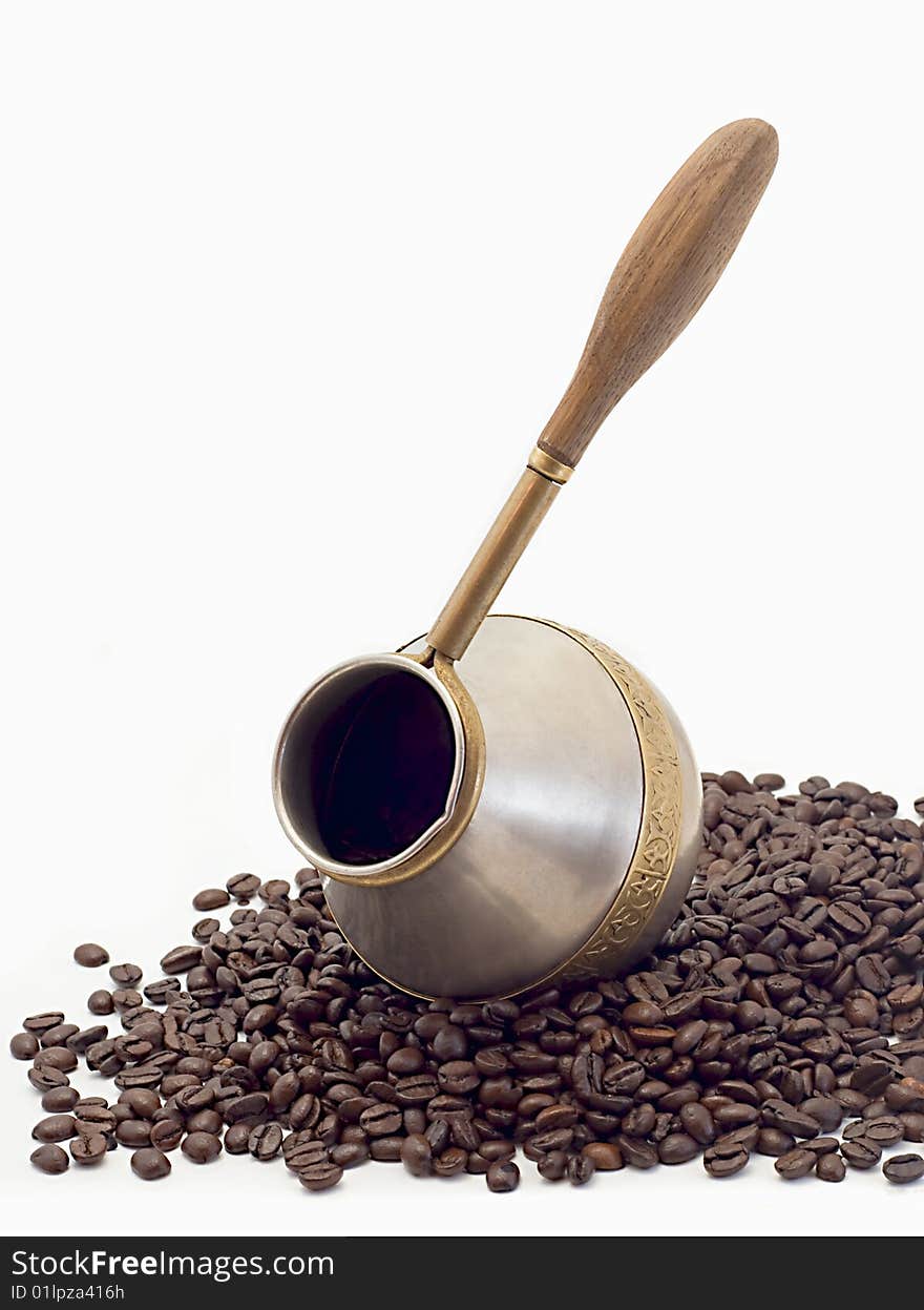 Coffee pot and coffee grains isolated on a white background