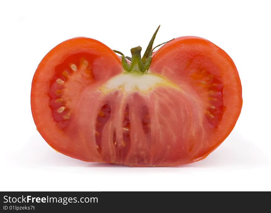 Cut red tomato  isolated on white background