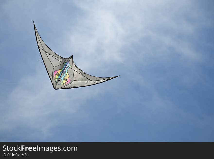 Bat winged kite races across the sky