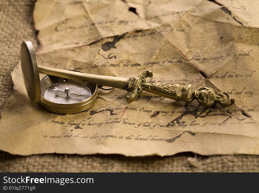 A beautiful old compass on an old letter