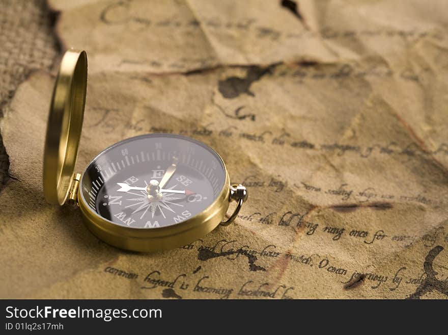 A beautiful old compass on an old letter