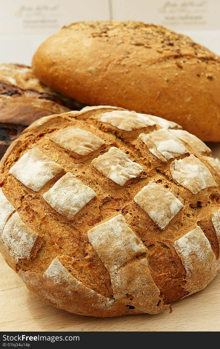 Different sort of  bread loaf on wooden desk