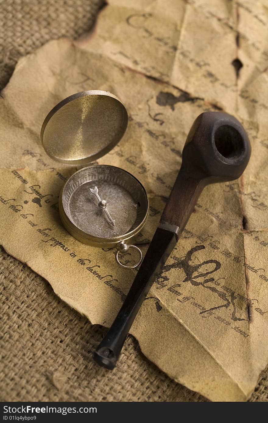 A beautiful old compass on an old letter