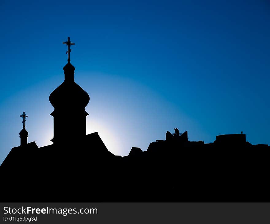 Dark silhouettes of orthodox cathedral against blue skies. Dark silhouettes of orthodox cathedral against blue skies