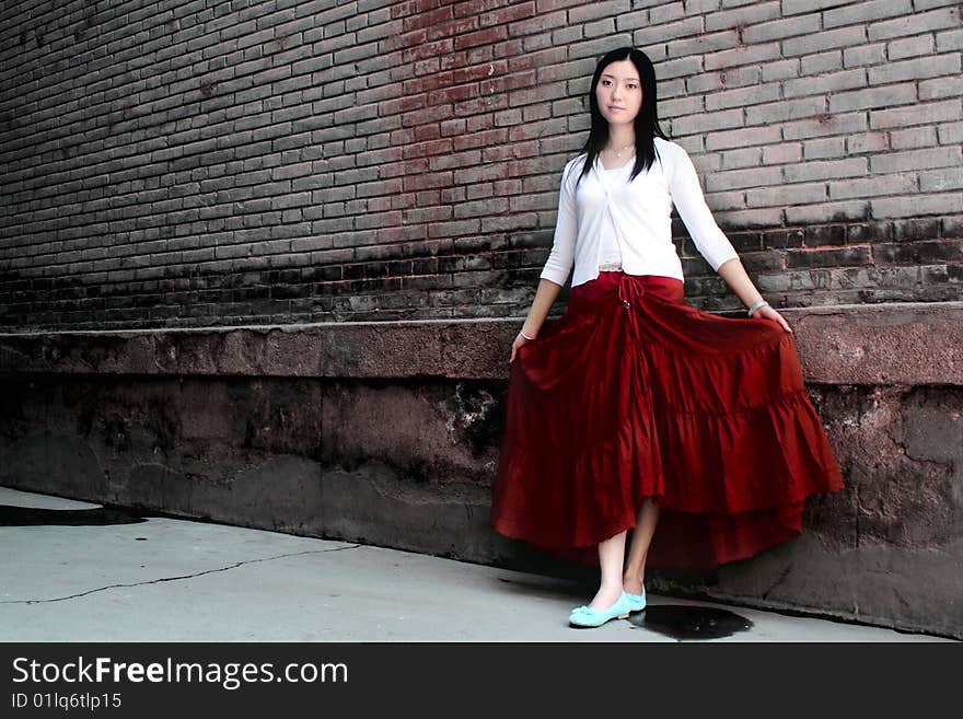 A girl wearing a red skirt