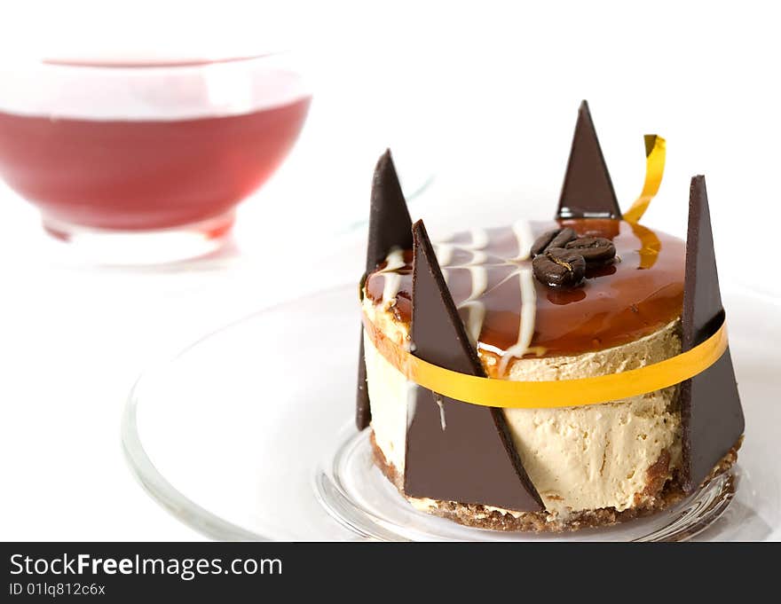 Sweet cake and cup of tea on white background