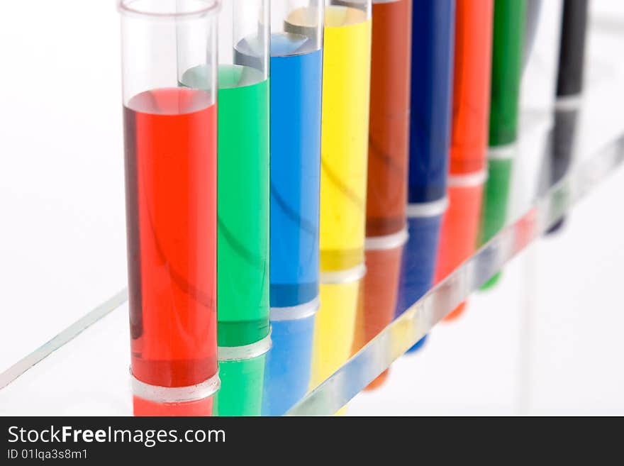 Test tube with colored water on white background. Test tube with colored water on white background