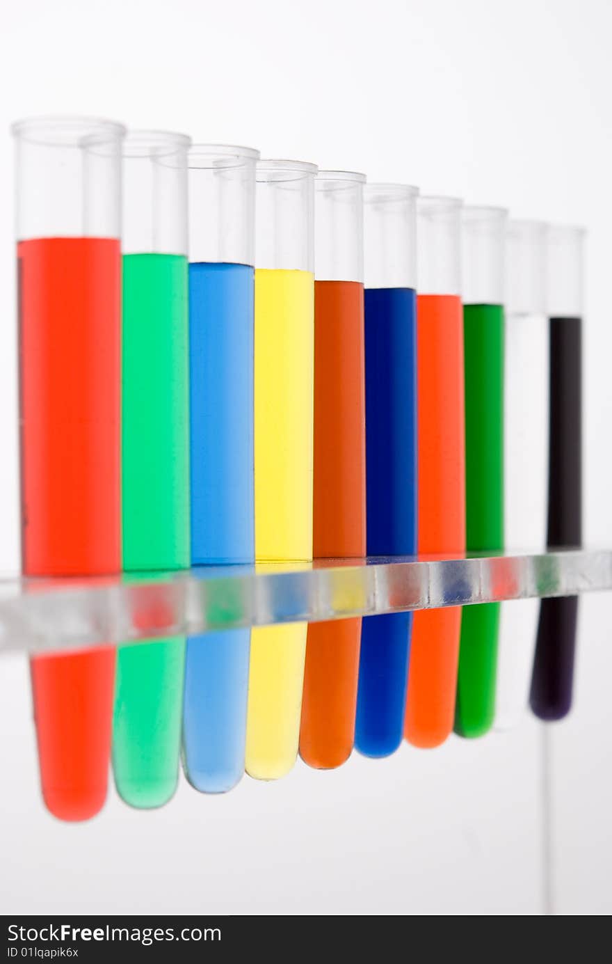 Test tube with colored water on white background. Test tube with colored water on white background