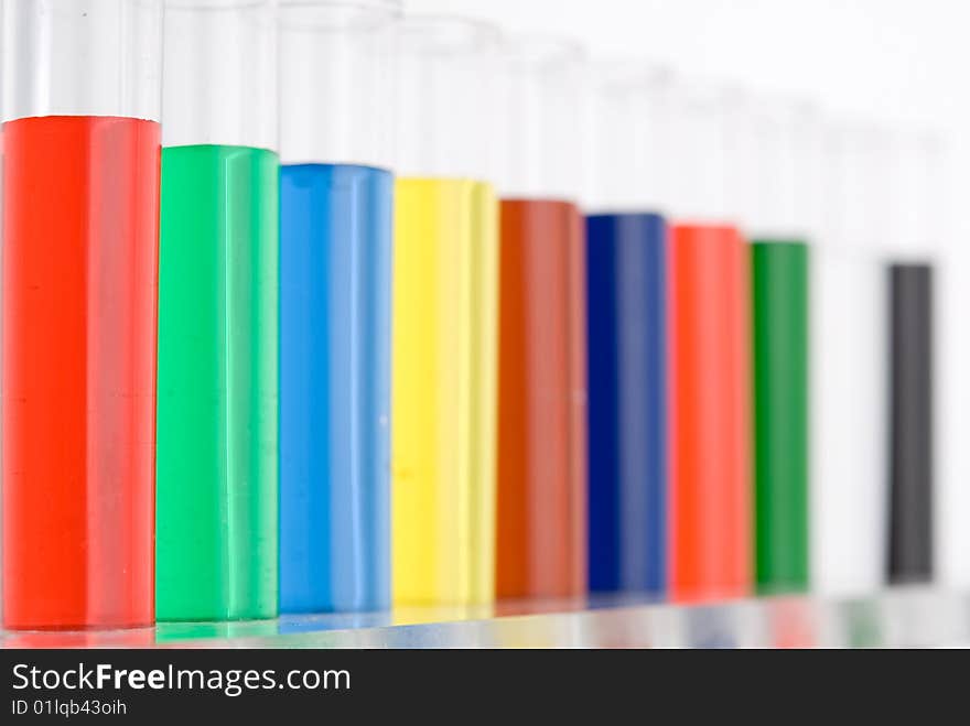 Test tube with colored water on white background. Test tube with colored water on white background