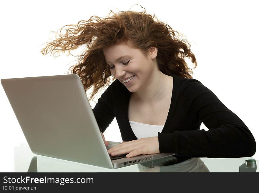 Red haired teenager with laptop, chat on the Internet