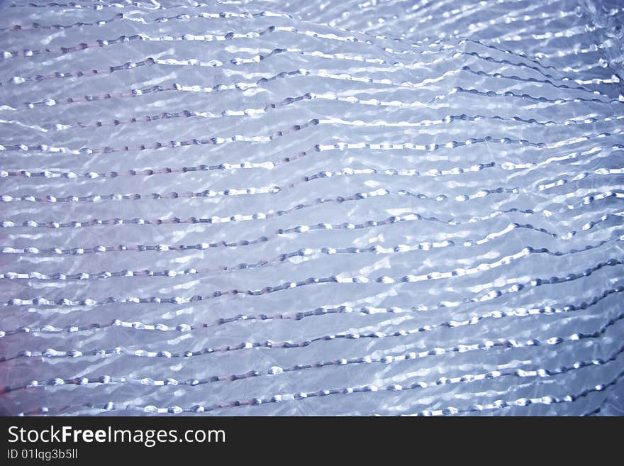 Texture of a transparent fabric with silvery strips