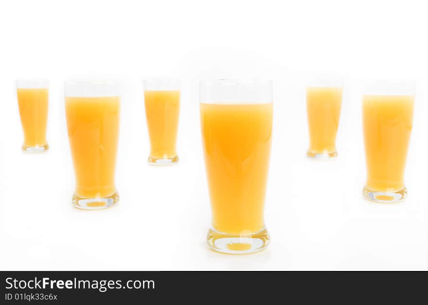 Glasses with orange juice on a white background