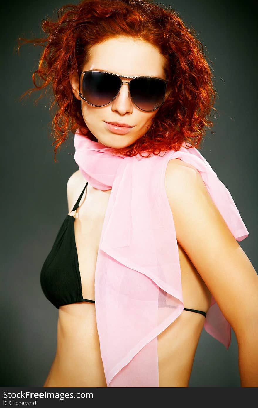 Close-up of beautiful woman face with red curly hair