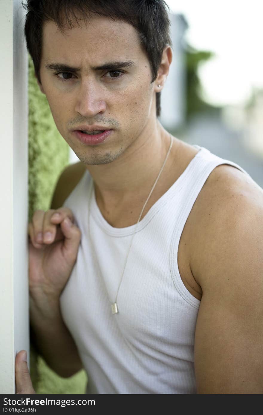 A young male model from Brazil in outdoors photograph. A young male model from Brazil in outdoors photograph.