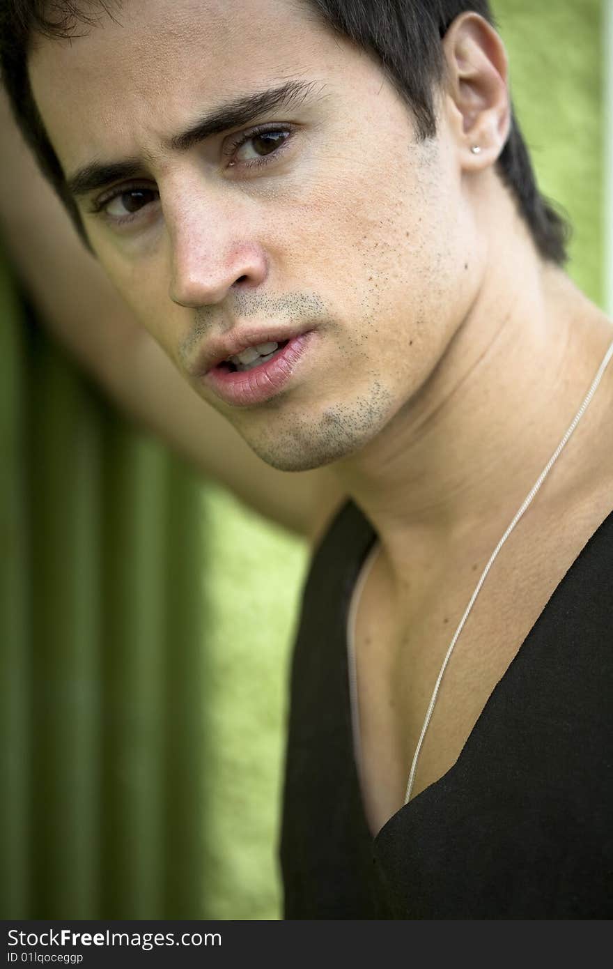 A young male model from Brazil in outdoors photograph. A young male model from Brazil in outdoors photograph.