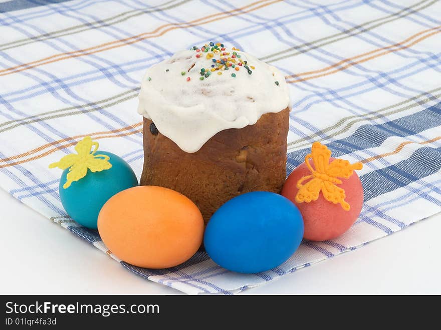 Easter cake and Easter eggs on background. Tradition decorative bread. Selective focus