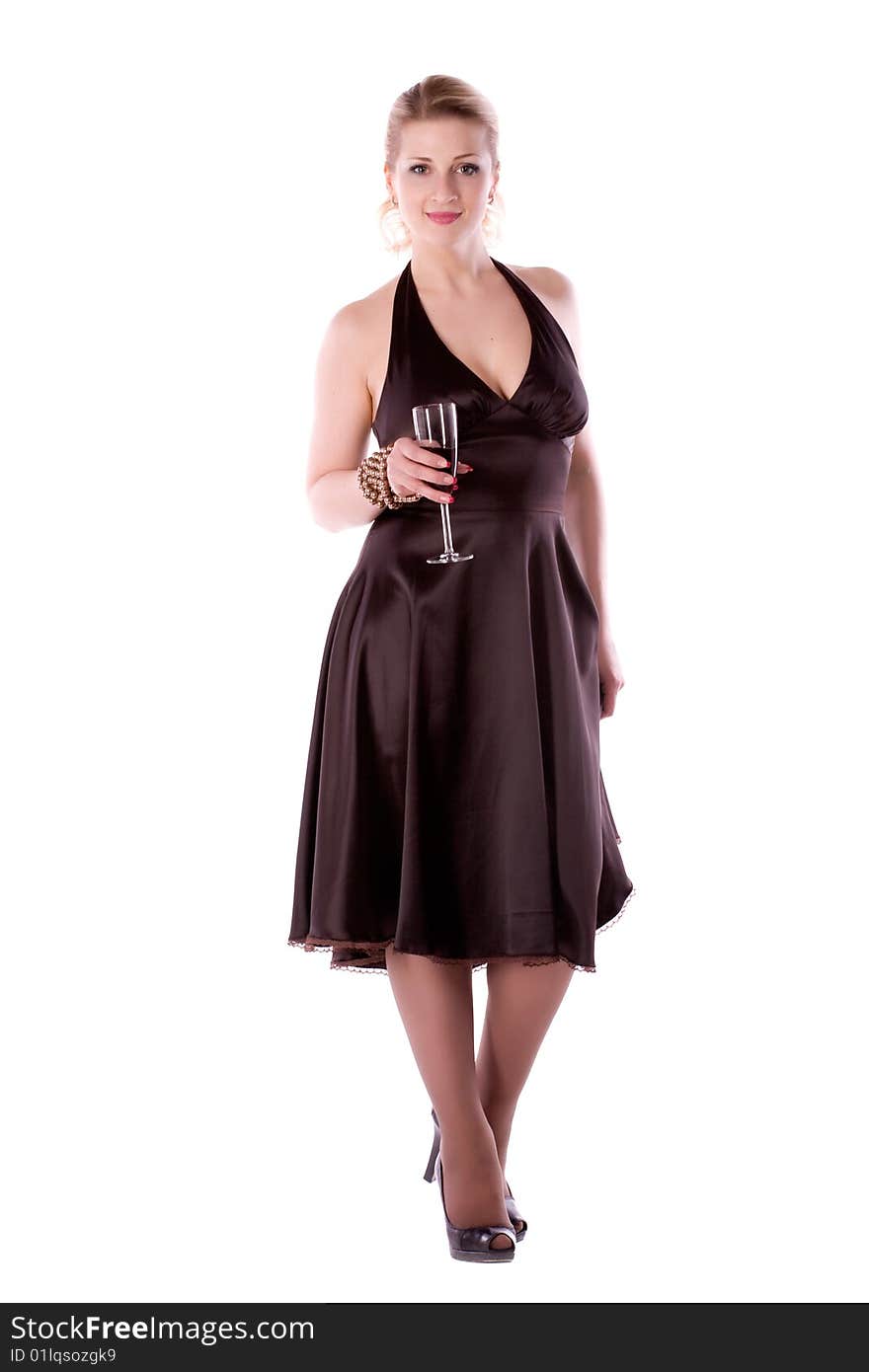 Woman in brown dress with a glass of wine on a white background. Woman in brown dress with a glass of wine on a white background