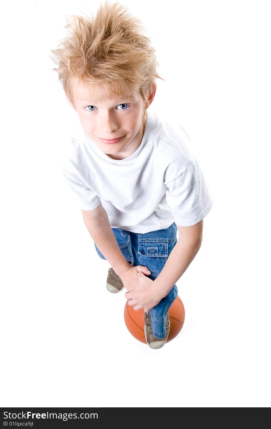 The boy with a basketball ball on a white background