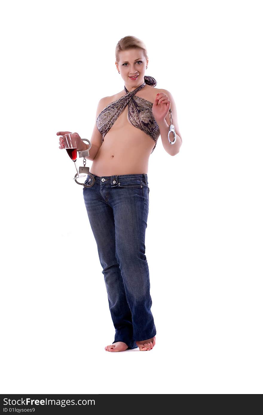 Woman with a handcuffs and red wine on a white background. Woman with a handcuffs and red wine on a white background