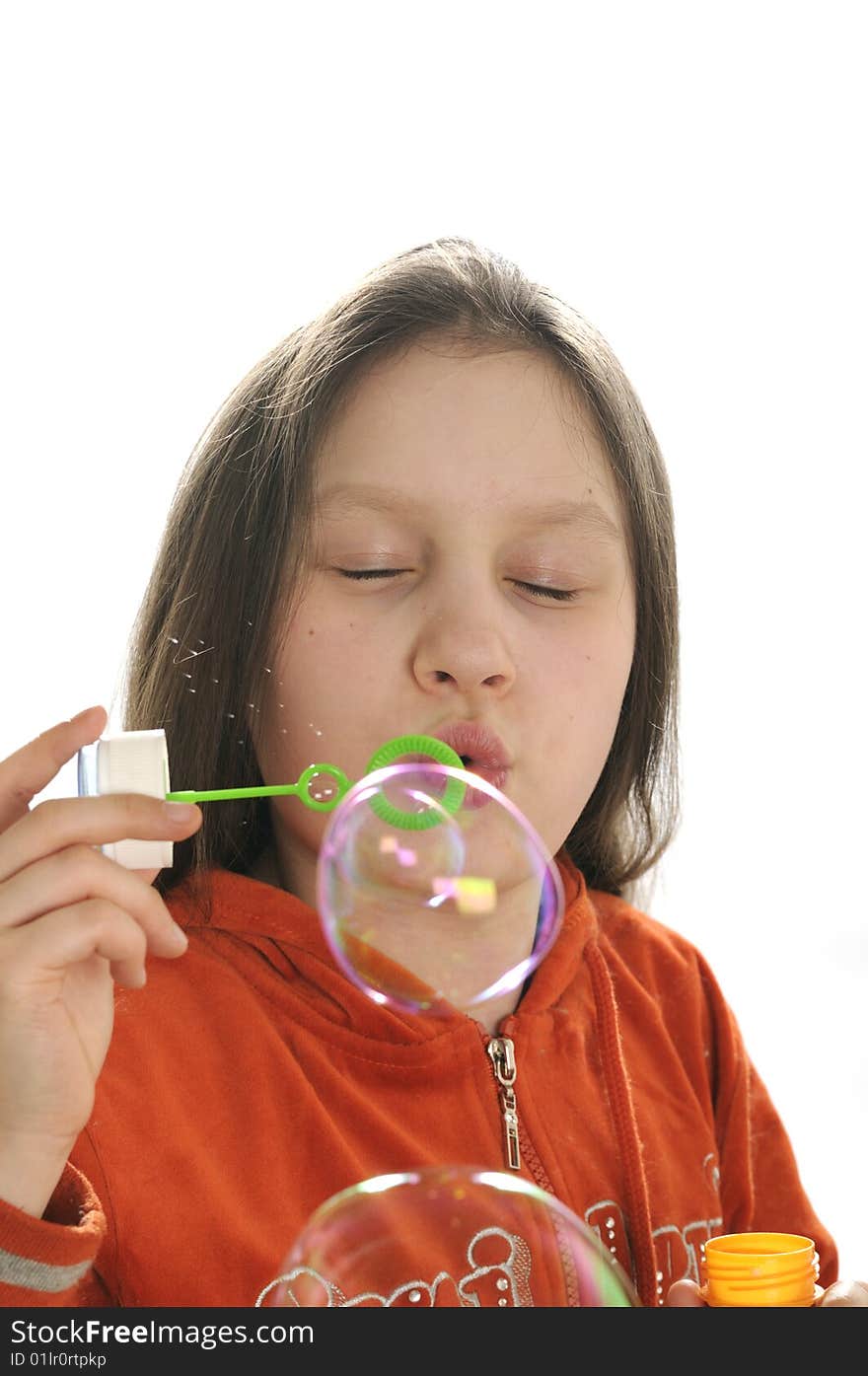 Young girl playing with water bubbles isolated on white background. Young girl playing with water bubbles isolated on white background