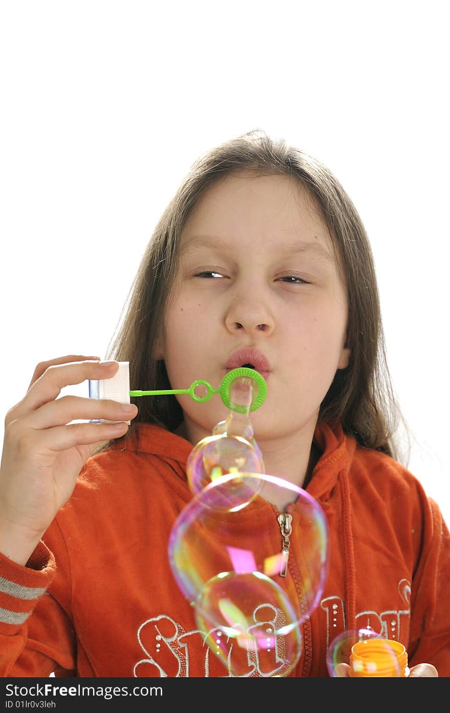 Young girl playing with water bubbles isolated on white background. Young girl playing with water bubbles isolated on white background