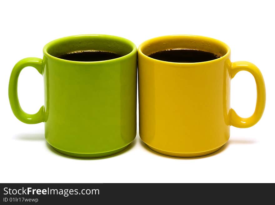 Yellow and green mug on a white background