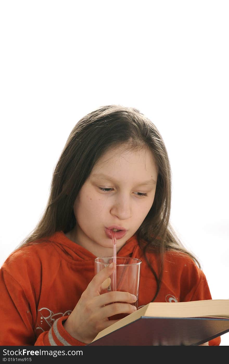 Reading girl with glass of juice