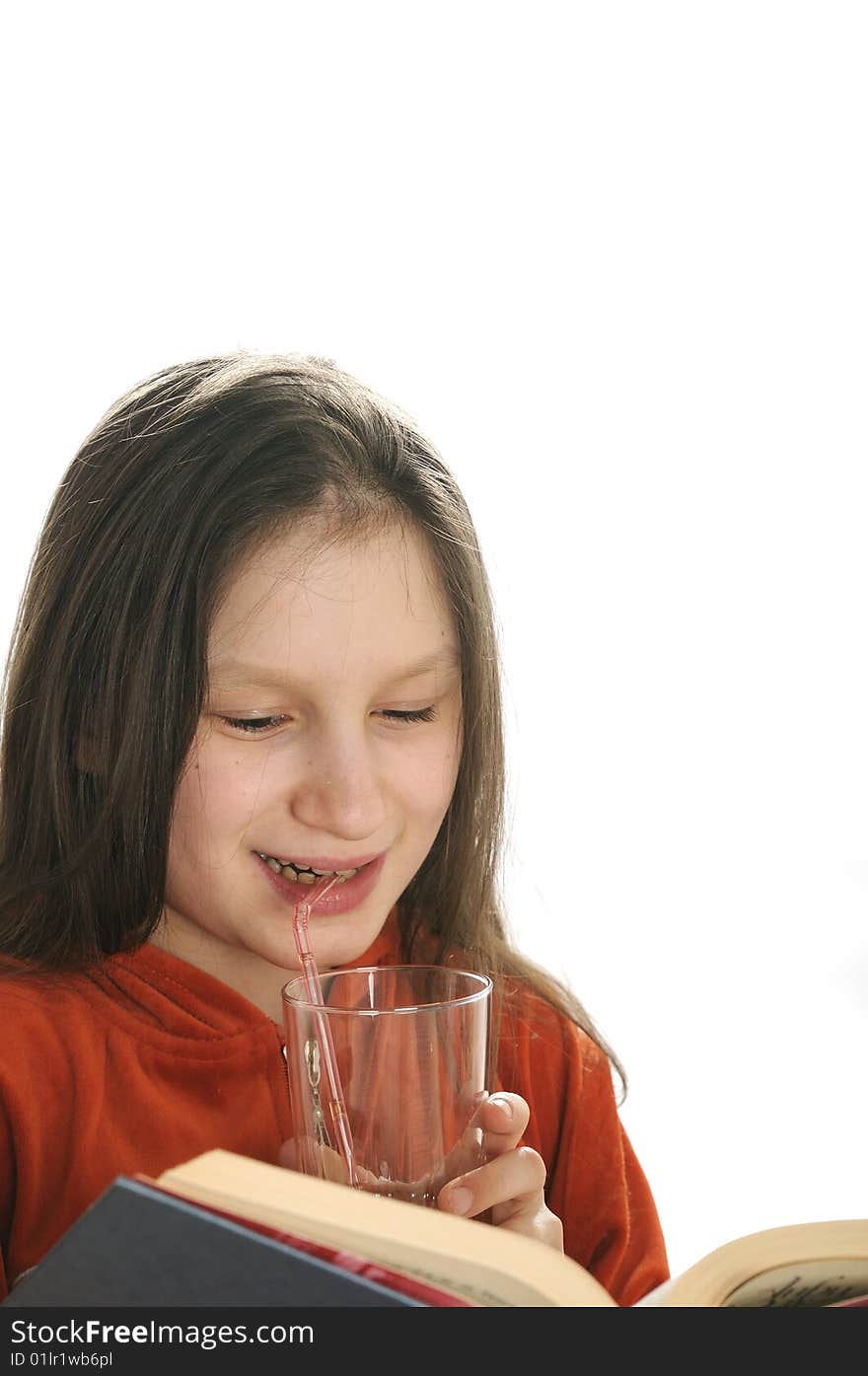 Young girl reading a book and drinking a fresh juice. Young girl reading a book and drinking a fresh juice