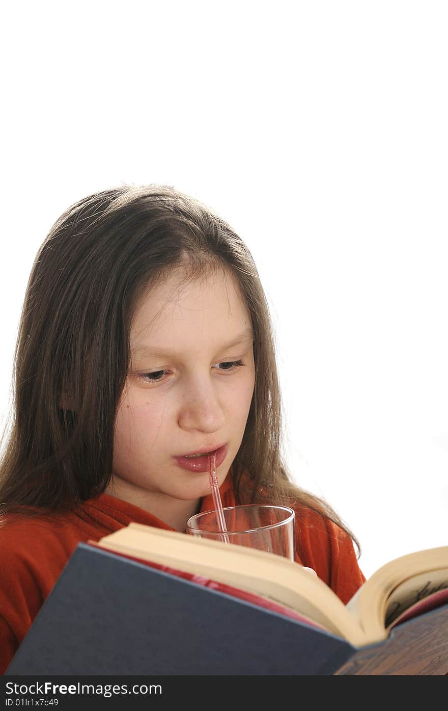 Young girl reading a book and drinking a fresh juice. Young girl reading a book and drinking a fresh juice