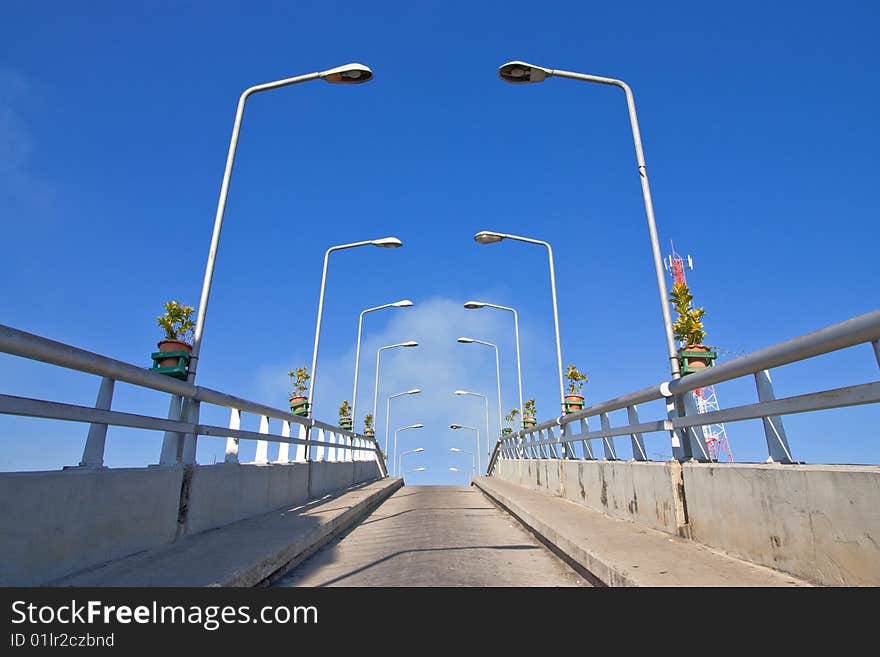 Bridge and light pillars in small district, Suphanburi province, Thailand.