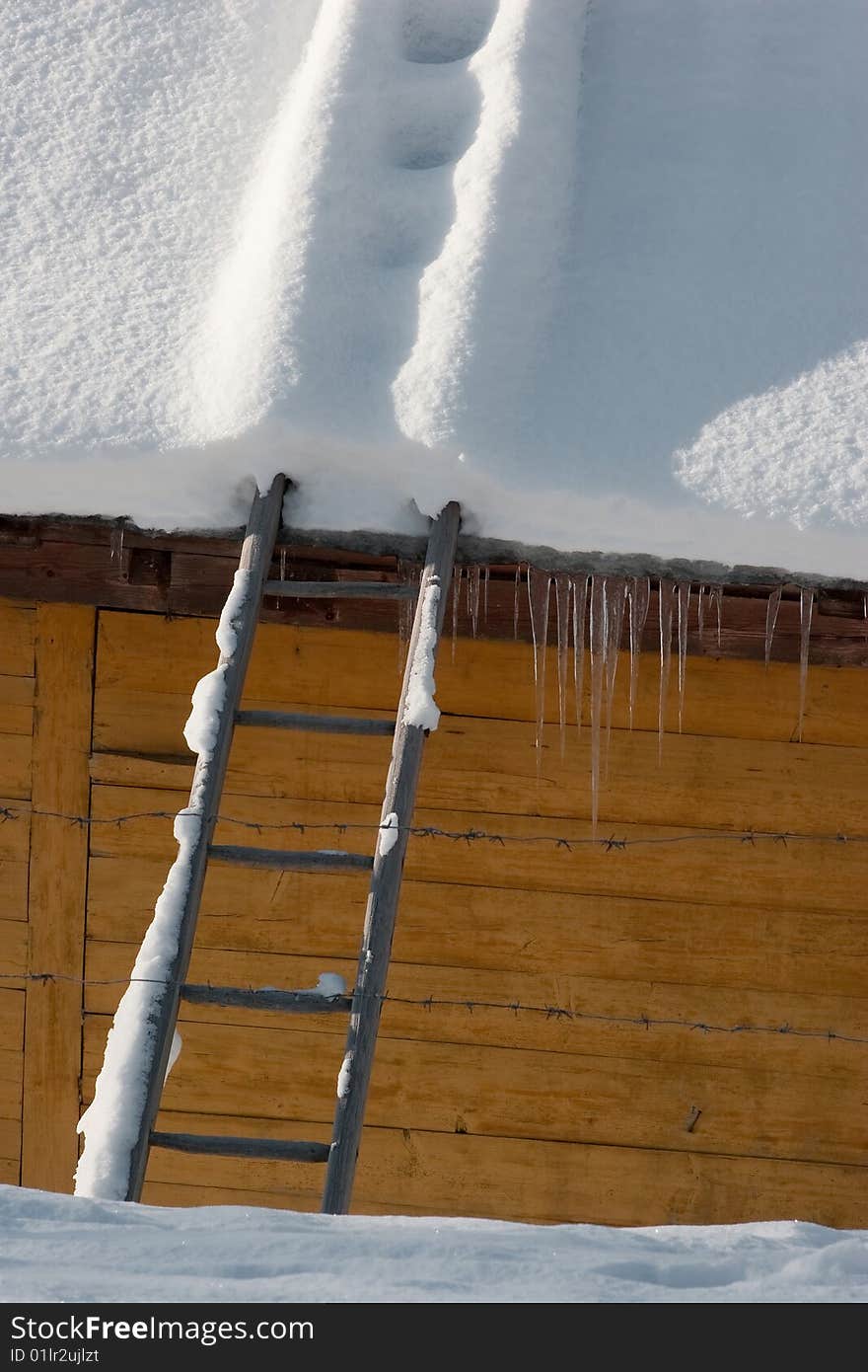 Snow on the roof of house and stair under snow