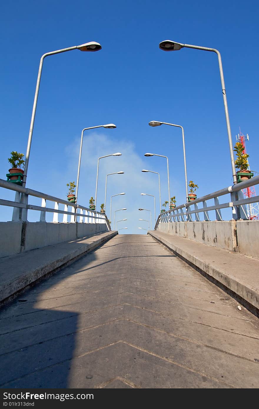 Bridge and light pillars in small district, Suphanburi province, Thailand.