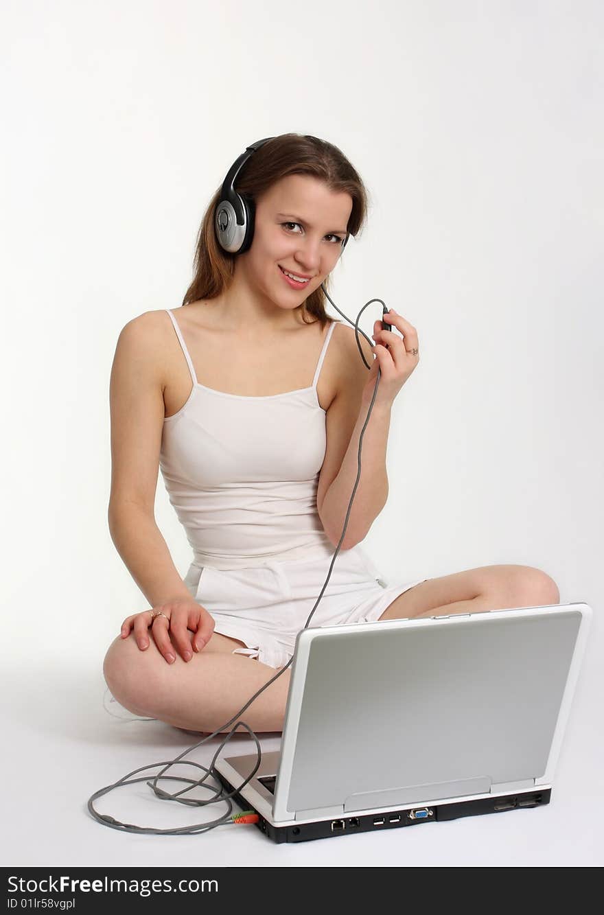 Woman with headphones and laptop