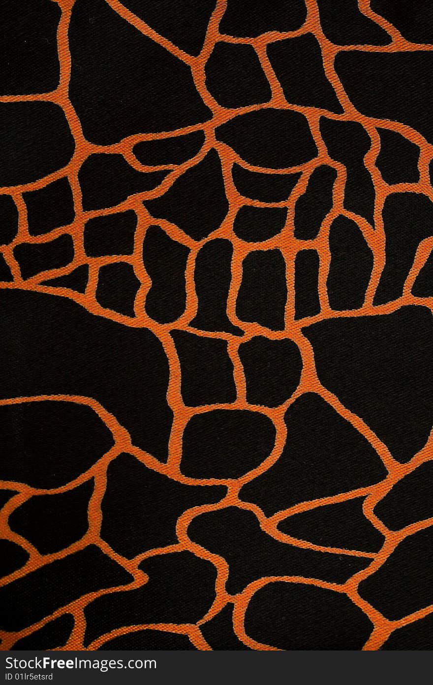 Close-up black fabric cloth with orange pattern