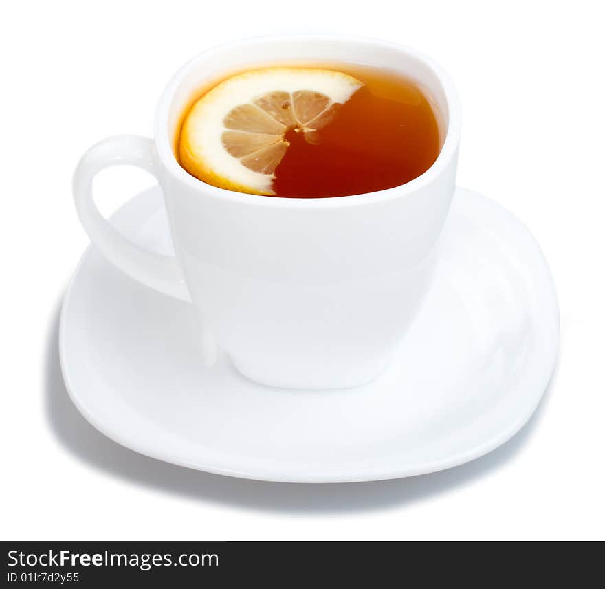 Cup of tea with lemon and saucer, isolated on white. Cup of tea with lemon and saucer, isolated on white