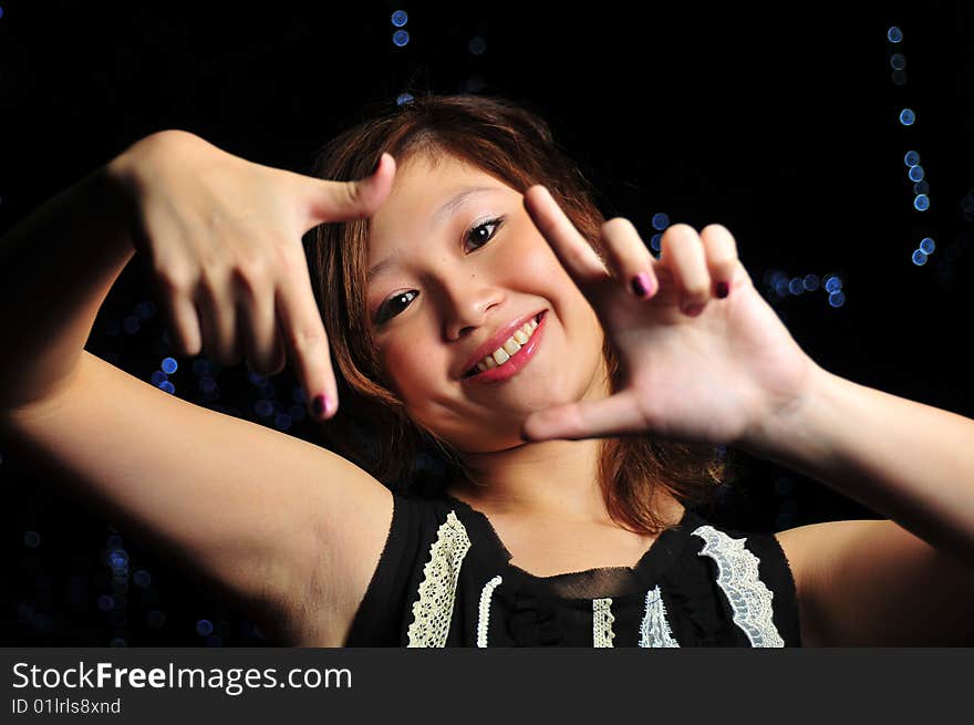 Beautiful Young Asian Woman With Framing Gestures