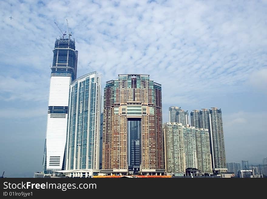 Hongkong, Kowloon, modern buildings, residential area at the harbour, near sea-side. Hongkong, Kowloon, modern buildings, residential area at the harbour, near sea-side.