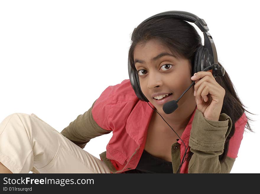 Young beautiful girl listening music in headphone over white background. Young beautiful girl listening music in headphone over white background