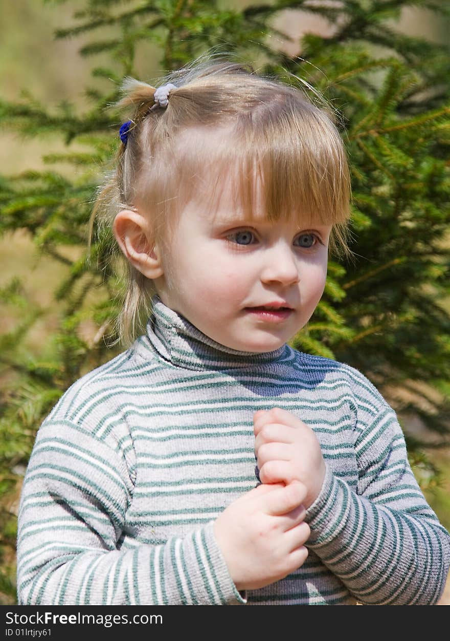 Beautiful smiling baby on the nature