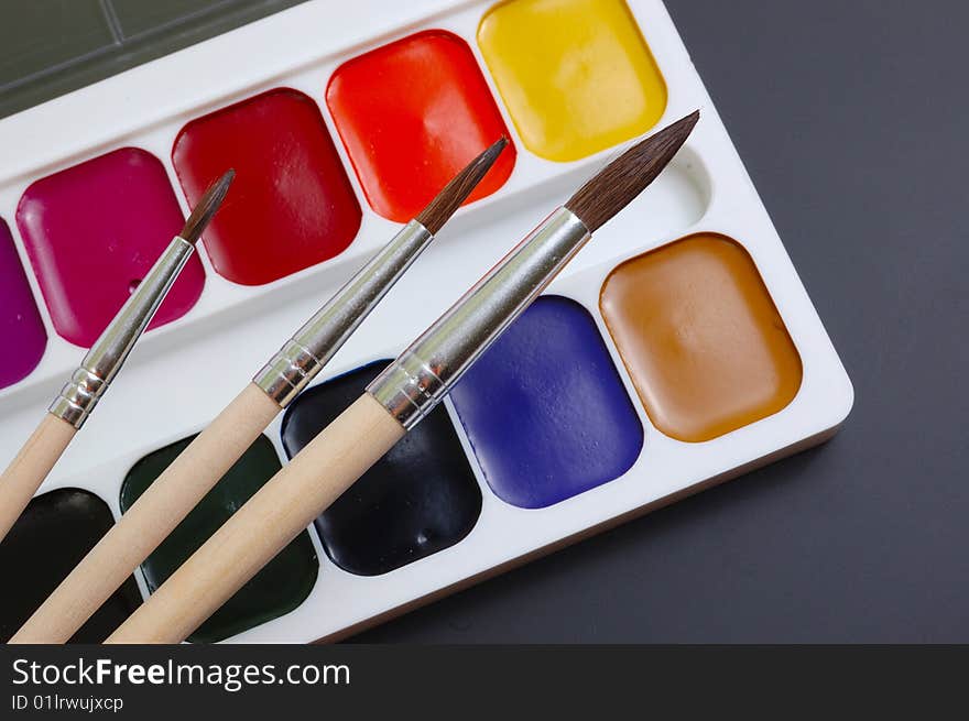 Collection of brushes and palette. Set the artist.