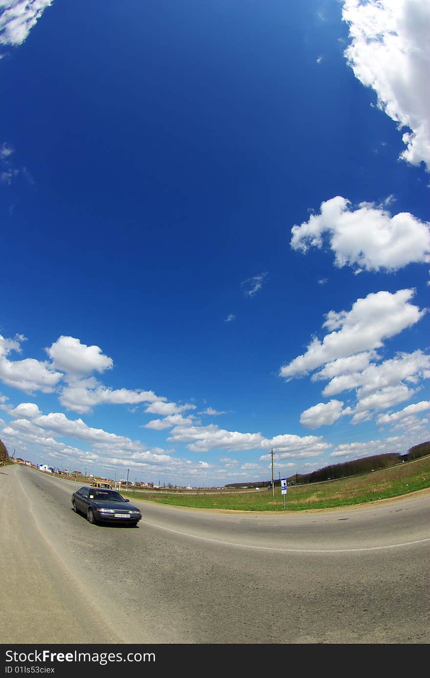 Field on a background of the blue sky. Field on a background of the blue sky