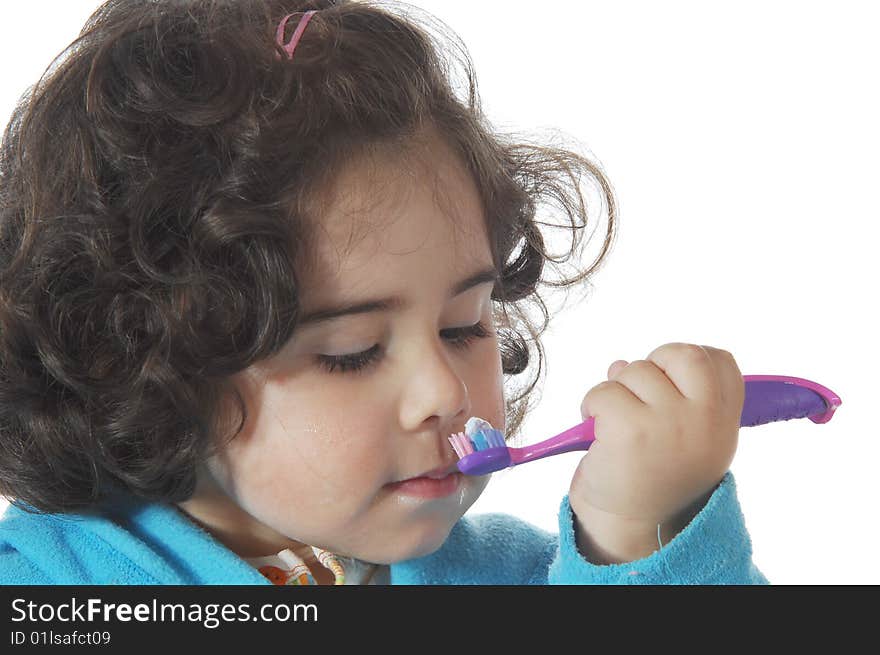 Little Cute Girl Brushing The Teeth