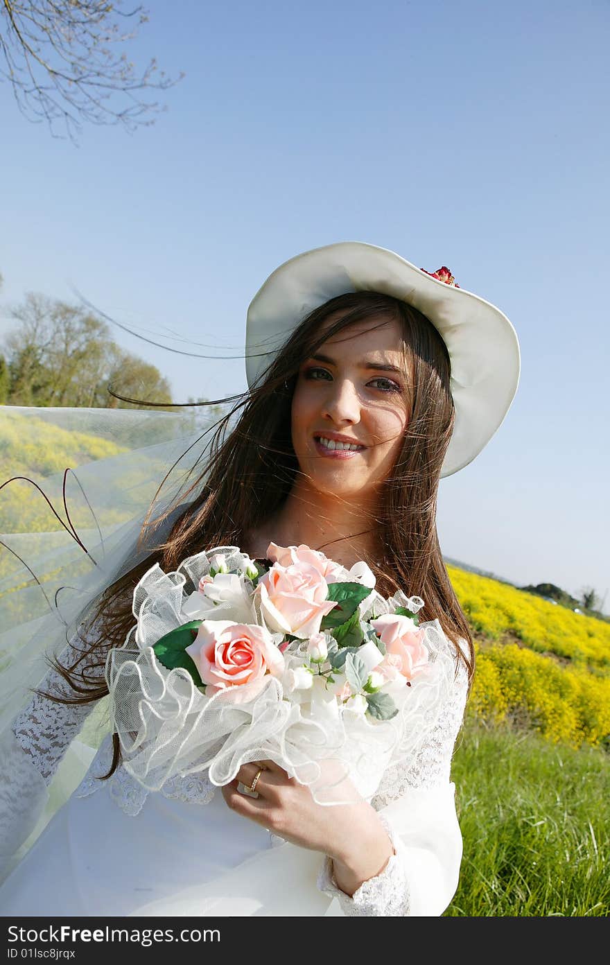 Young Bride With Bouquet In A Field